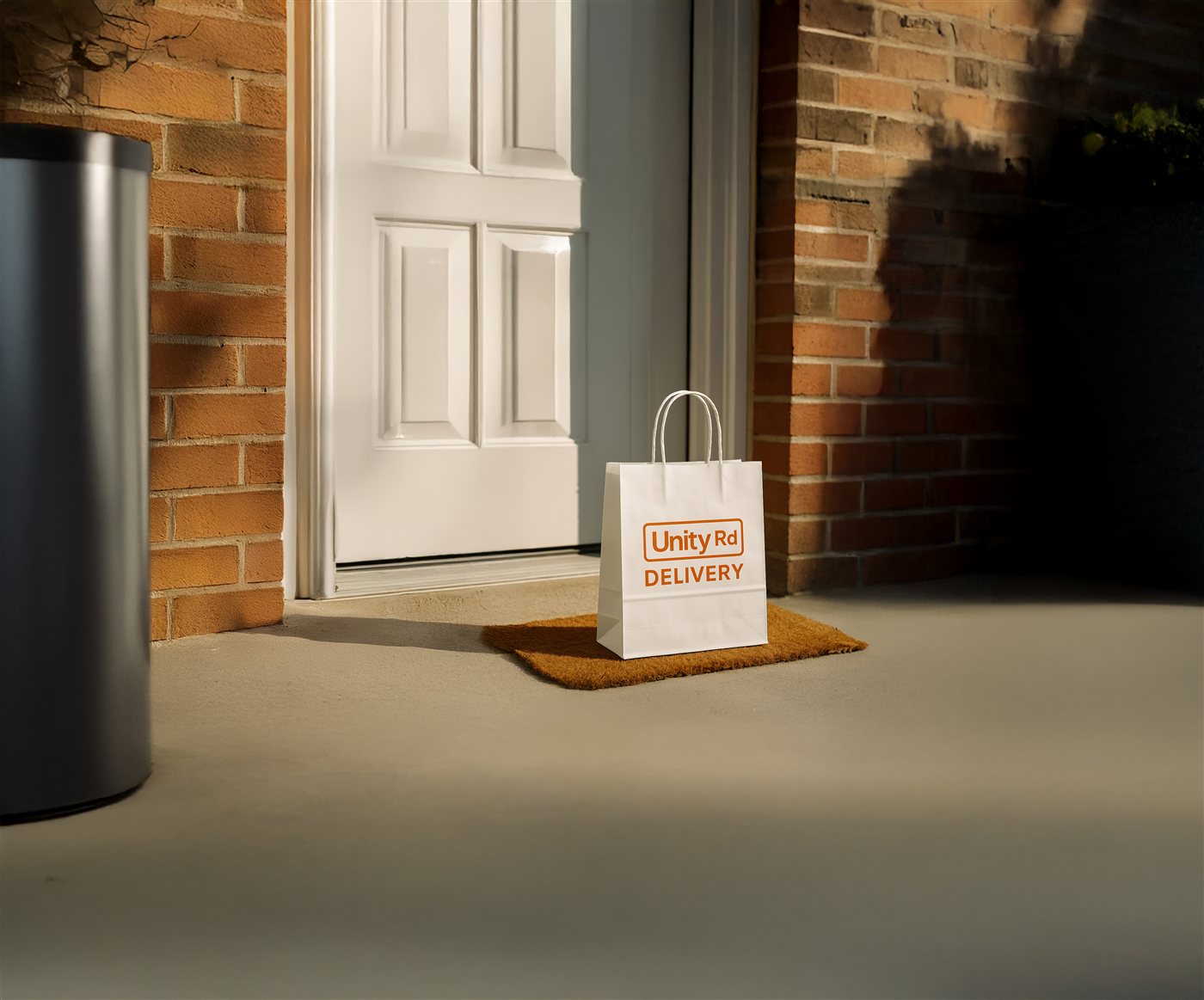 Unity Rd Delivery bag waiting at a front door